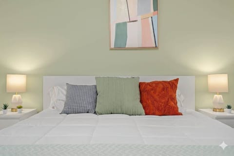 Relaxing bedroom with calming colors and natural light.