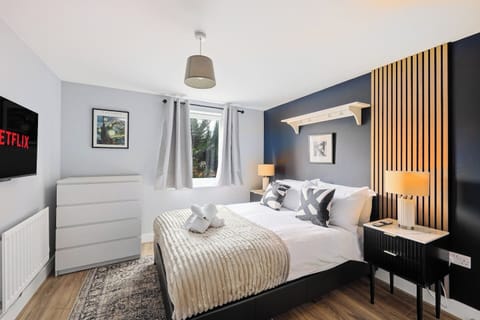 The master bedroom features a comfortable double bed and a en-suite shower.