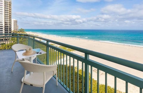 Sip morning coffee on the balcony above turquoise waters.