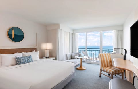 Wake up to ocean views and sip coffee by the balcony.