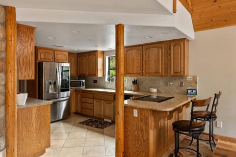 Warm wood kitchen with modern touches.