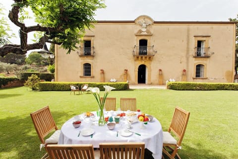 The imposing facade and front lawn. 