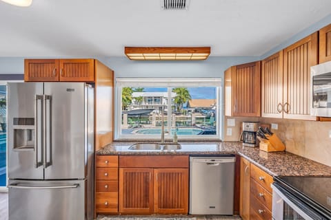 Fully equipped kitchen with stainless steel appliances and granite countertops in Florida Keys vacation home.