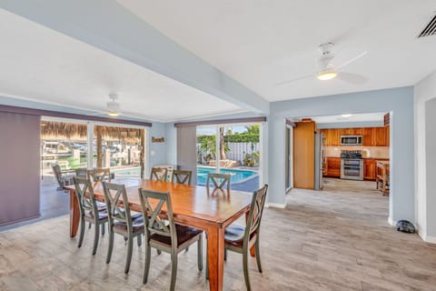 Dining table with seating for eight and panoramic ocean views at Key Colony Beach Florida Keys waterfront vacation home.