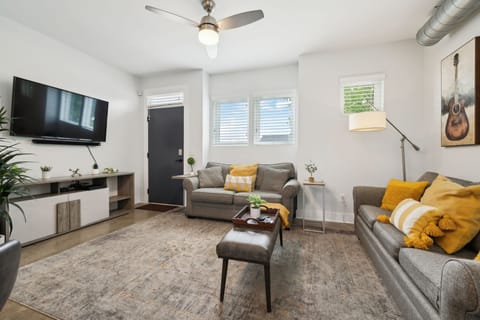 Living Room: Where modern comfort meets curated style—unwind in the heart of it all.