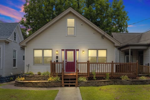 Exterior: Step into comfort and style — your private retreat awaits behind this charming red door.