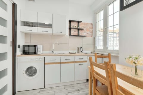 The fully equipped kitchenette includes everything you need for a home-cooked meal.