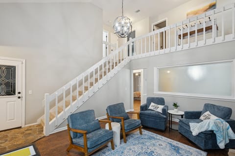 Clean, well-lit staircase leading to the main living spaces for easy flow throughout the home