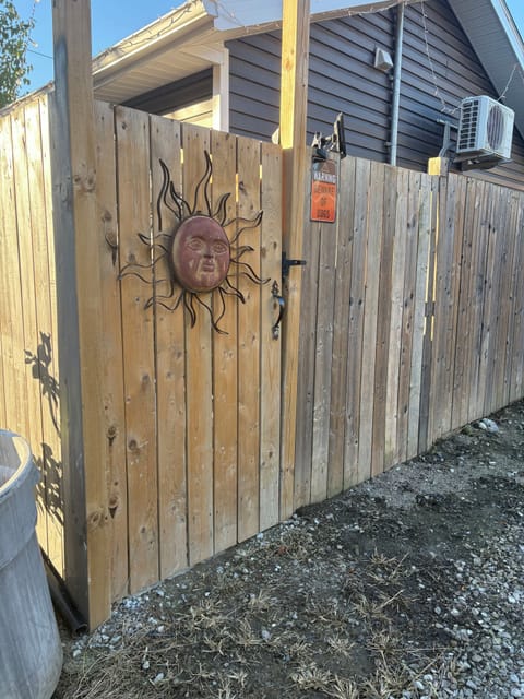 Parking along side this fence. This is the entrance door.