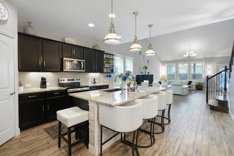 Kitchen + Dining  “A chef‑ready kitchen designed for cooking, gathering, and great conversations.”