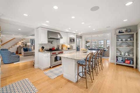 Fully equipped kitchen with modern appliances, dining area & seating for 8