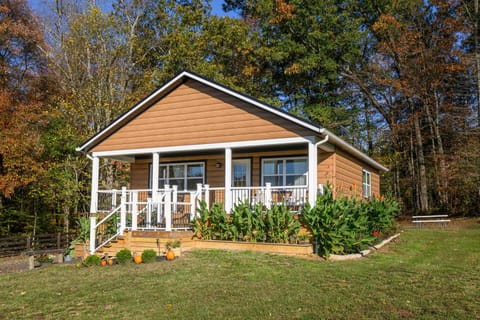 Front of cabin, driveway located on the left side with parking