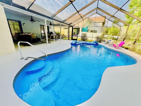 Stunning blue heated pool and outdoor living space. 