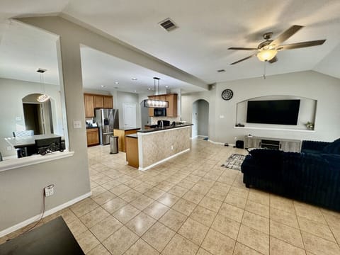 Spacious open-concept layout featuring a modern kitchen, cozy living area, and plenty of room to relax together.