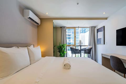 Bedroom with natural light and city views