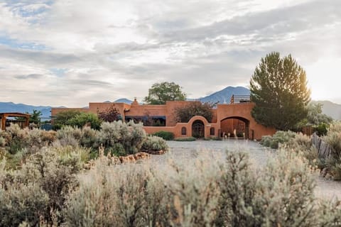 Welcome to a serene desert retreat set against the Sangre de Cristo Mountains.
