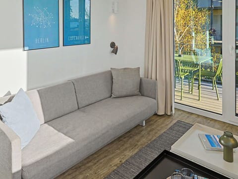 Furniture, Interior Design, Flooring, Floor, Wood, Couch, Living Room, Room, Apartment, Table