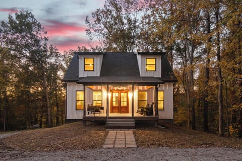 Twilight Welcome — arrive to warm glow and forest serenity at Nolin Hill House.