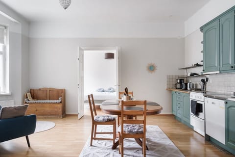 Everything you need is right here! The fully-equipped kitchen with its statement cabinetry blends seamlessly into the bright, open dining area.