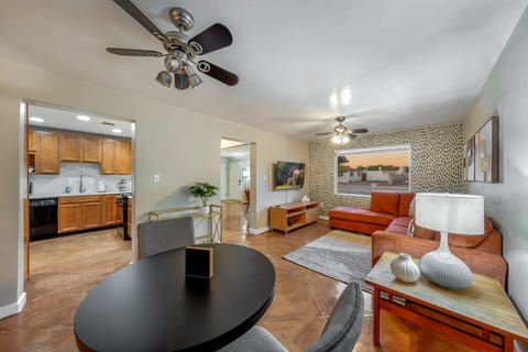 View of the home`s kitchen, dining area, and living room