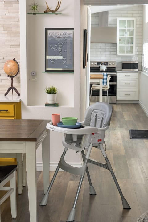 High chair for kids and children dinnerware set available for use.