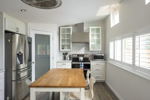 Kitchen offers large pantry for storage.