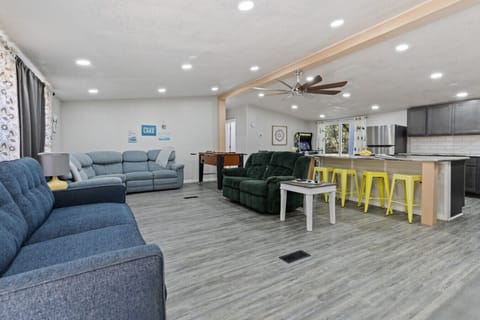 Spacious Living Room | Cozy Sofas & Recliners | Open Layout to Kitchen | Foosball Table for Fun