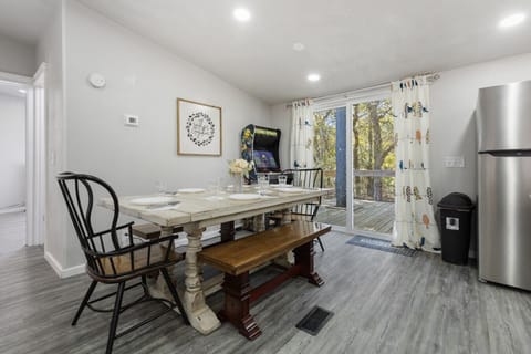 Dining Area | Farmhouse-Style Table | Open Concept to Kitchen & Living Room | Bright Space with Modern Lighting