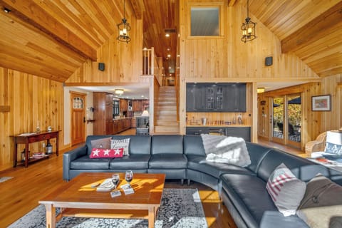 Bright seating nook with lake views and cozy blankets