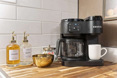 Coffee station detail w/ drip machine, mugs & thoughtful touches for easy mornings