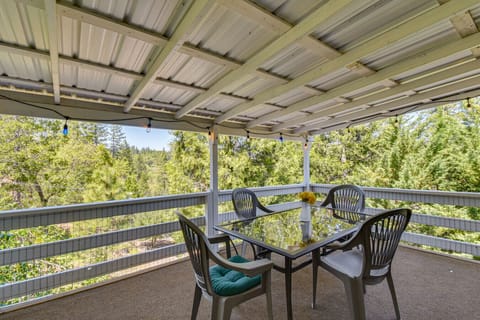 Covered deck with outdoor dining | Enjoy peaceful forest views
