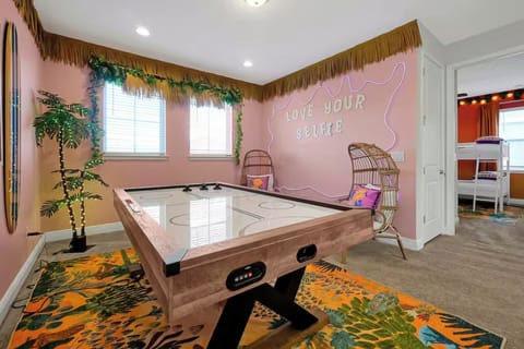 From friendly air hockey matches to feel-good selfies, this vibrant game room brings everyone together.