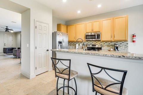 A cozy kitchen with a breakfast bar, perfect for sipping coffee and enjoying casual meals.