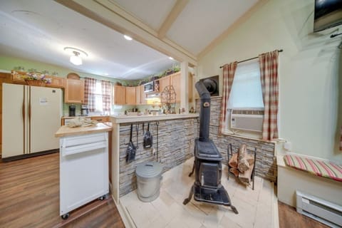 Stay warm and cozy by the wood-burning stove, the perfect spot to unwind after a day of exploring.