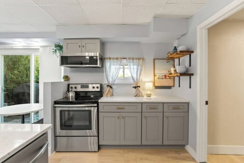 Prepare your favorite meals in this inviting kitchen, where space and style make cooking feel effortless.