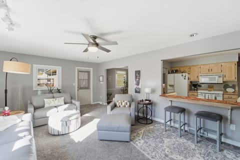 With casual barstool countertop seating and plush couches in a sun-filled den, there is plenty of space for the family to come together.