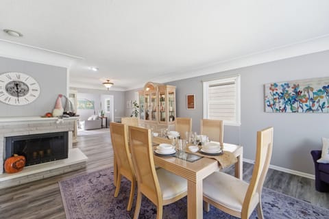 Open naturally light dining space greats you as you enter the Cozy Heights Retreat.