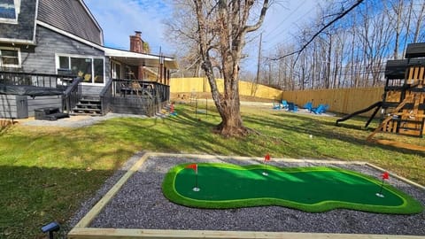 3 hole putting green with adult and kids putters