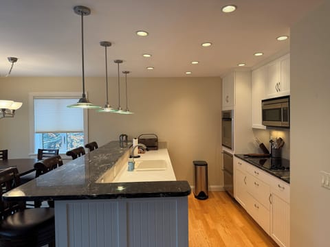 Kitchen with bar top seating