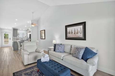 Bright, open-concept living area with beautiful views of the marina and the Gulf.