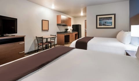 Settle in with in-room kitchenette and comfy beds nearby.