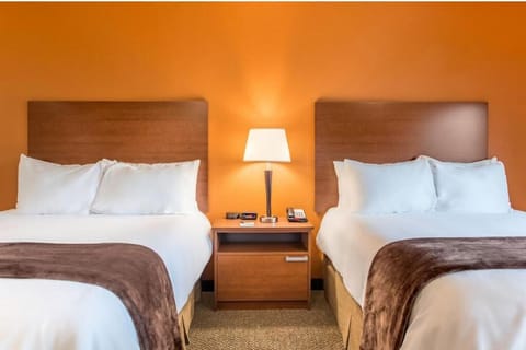 Sink into plush pillows after a long day of exploring.