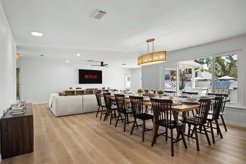 Open floor plan with living room, dining area, and modern kitchen