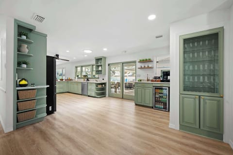 Full-size laundry room with washer, dryer, and storage space