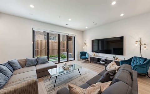 Spacious Living Area for up to 10 guests with an 85" Flat Screen TV for all your Movie Night Needs