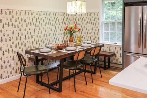 Gather ‘round! The dining table seats 6–8 comfortably with 3 chairs and 2 long benches—perfect for meals, board games, or planning your next White Mountains adventure.