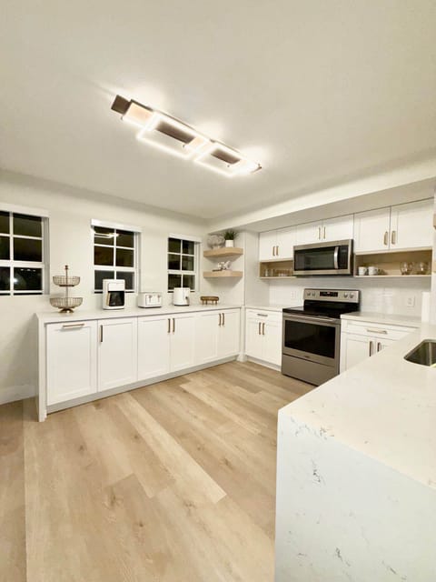 Gourmet kitchen with quartz counters and premium appliances.