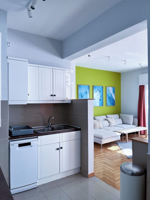 A view from the fully equipped kitchen toward the living room.