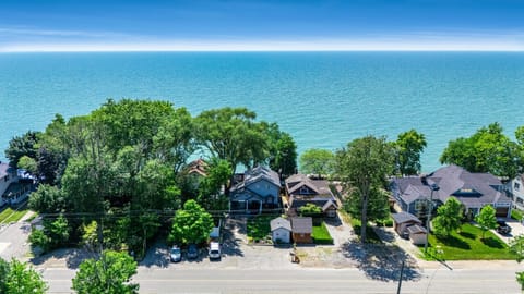 Three side-by-side lakefront homes on Point Pelee Drive