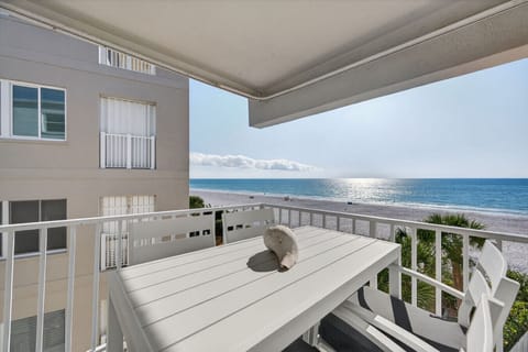 Sip morning coffee on the covered balcony w/ ocean views & a breezy table for easy outdoor dining